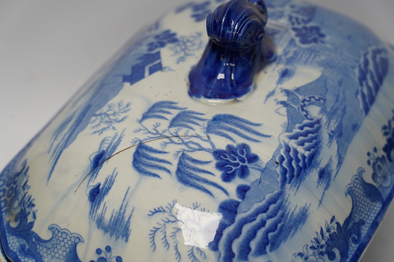 A Victorian Staffordshire blue and white pottery soup tureen and cover, together with a meat dish (2). Condition - tureen cover cracked